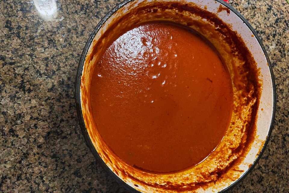 A close-up shot of Italian tomato sauce made with pork.