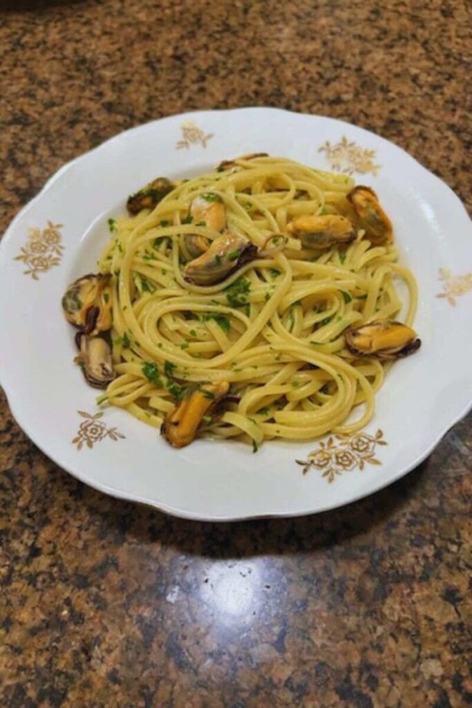 A freshly made dish of mussels linguine.