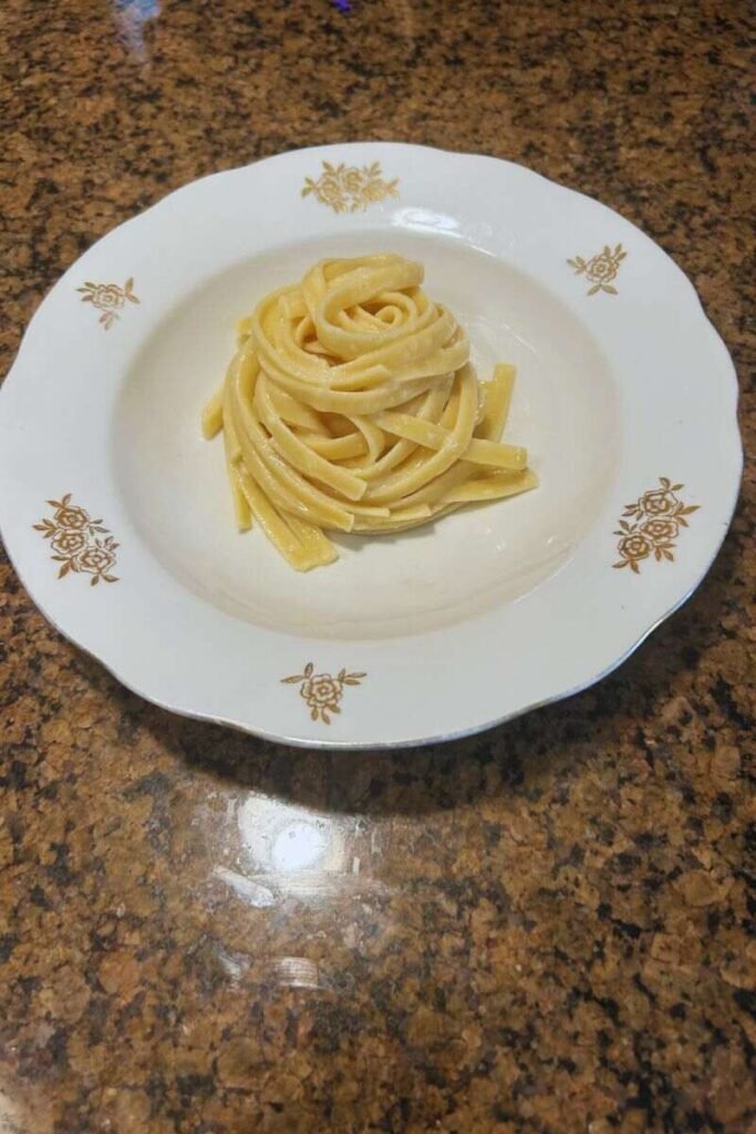 A plate of authentic Fettuccine Alfredo.