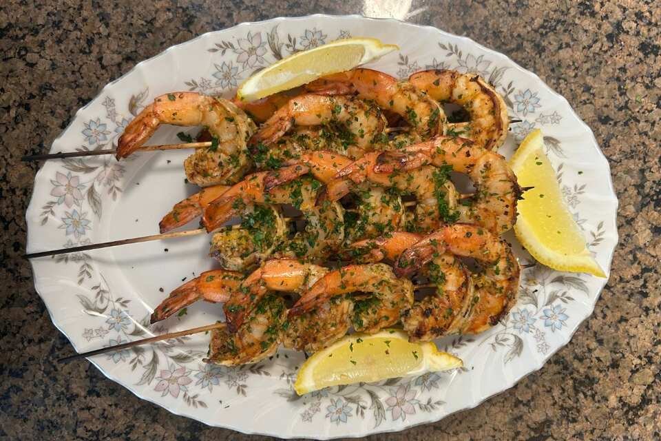 Close-up of Lemon–Garlic Shrimp Skewers.