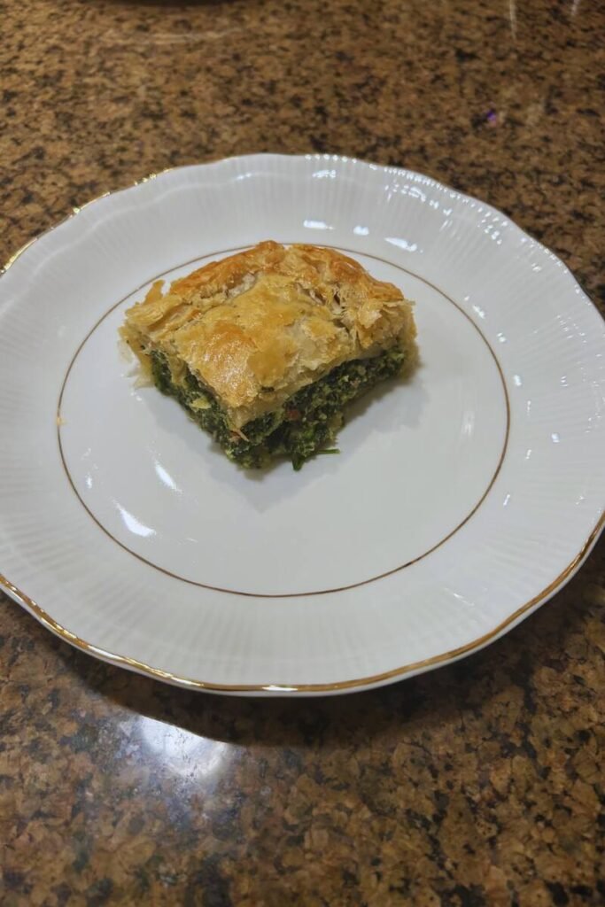 Ricotta and Spinach Pie with Puff Pastry on a plate.