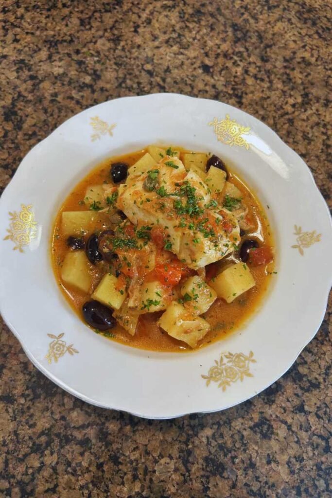 White Wine Braised Cod with Potatoes, Olives, Capers, Lemon & Parsley
