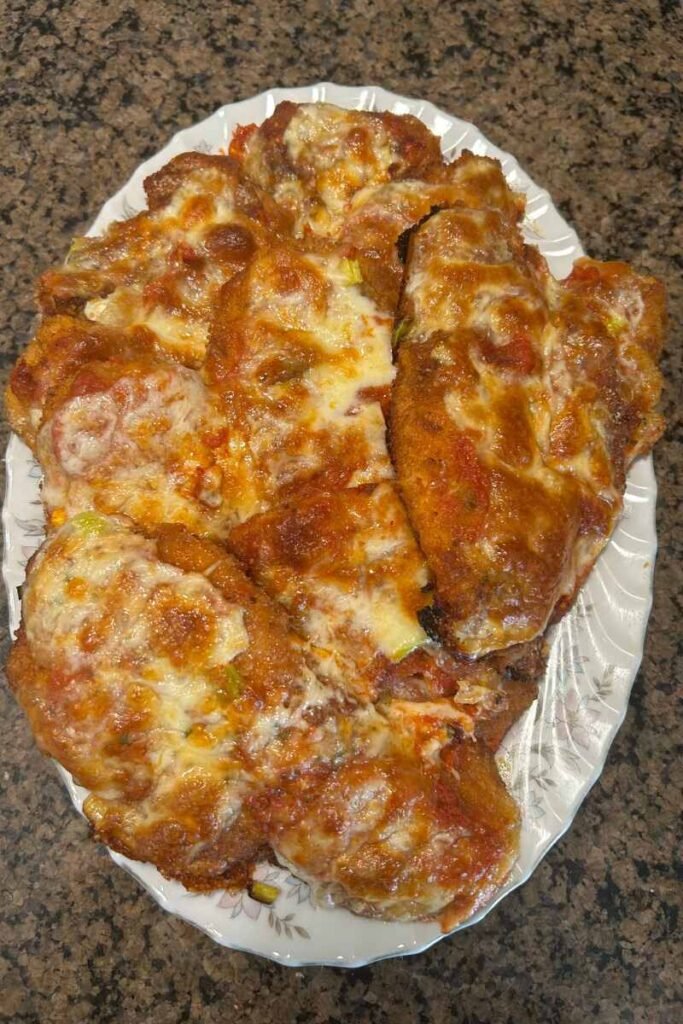 Chicken Parmigiana on a platter on my countertop.