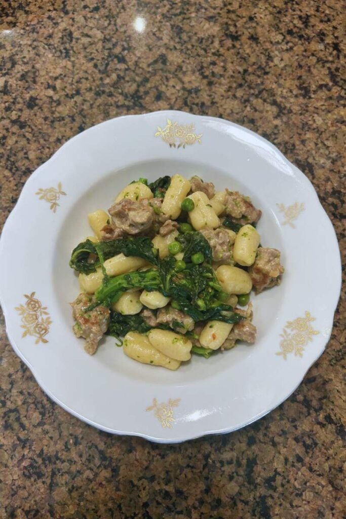 Ricotta Gnocchi with Sausage, Rapini, and Sweet Peas Featured Image
